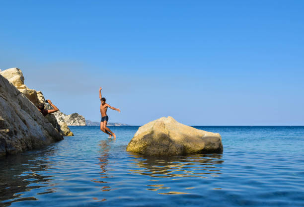 istock Jump into the sea. 958937472
