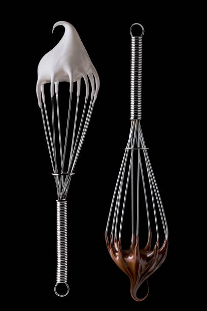 istock Whisk with meringue cream and melted chocolate Isolated on white 958940114