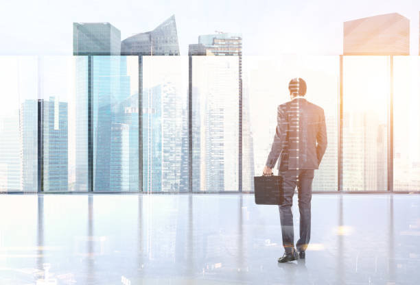 istock African American man suitcase modern office lobby 958952682