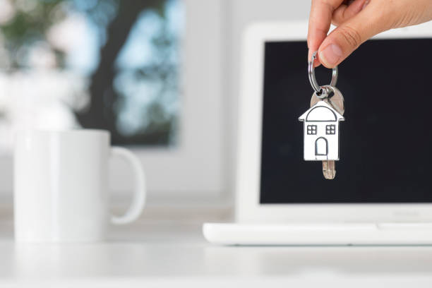istock Real Estate Agent Giving House Keys 958953128