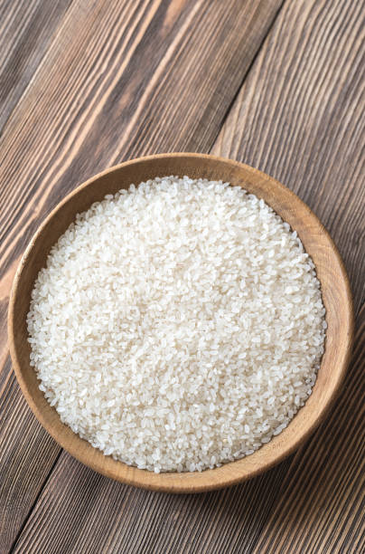 istock Bowl of uncooked camolino rice 958953758
