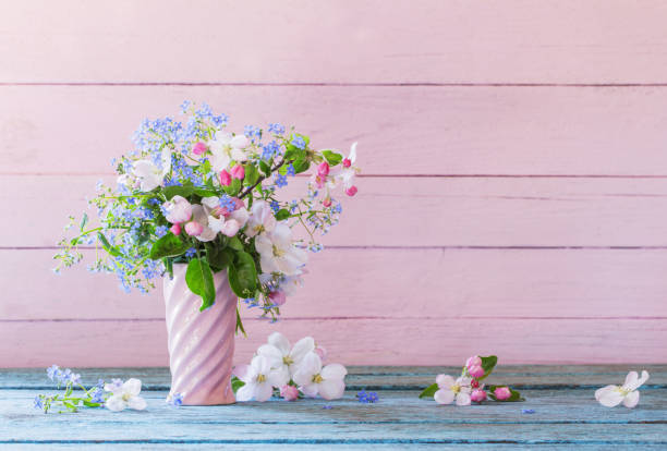 istock spring flowers in vase on wooden background 958954030