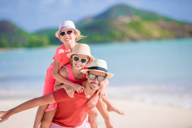 istock Father and kids enjoying beach summer vacation 958957712