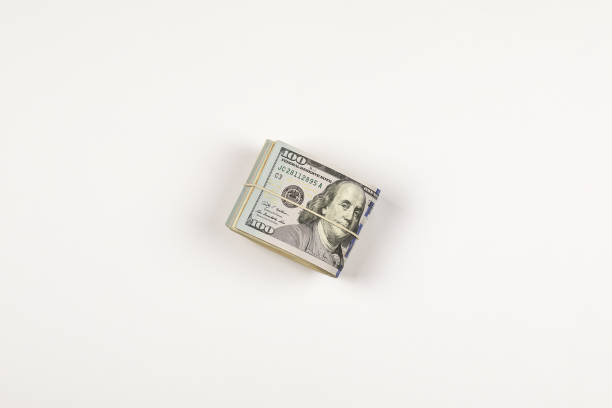 istock Stack of USA 100 dollars isolated on white background. 958960968