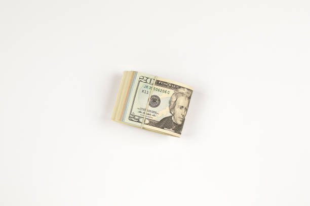 istock Stack of USA 20 dollars isolated on white background. 958961724