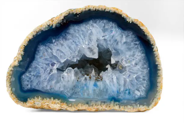 Photo of Geode with crystals of light-blue color. Cross section of natural stone