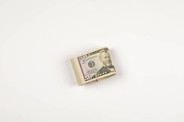 istock Stack of USA 50 dollars isolated on white background. 958965514