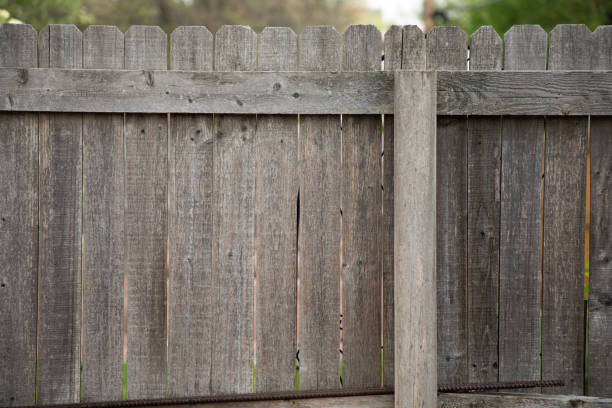 istock Old Dark Wooden Fence 958965746