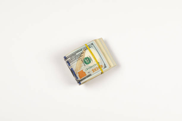 istock Stack of USA 100 dollars isolated on white background. 958968748