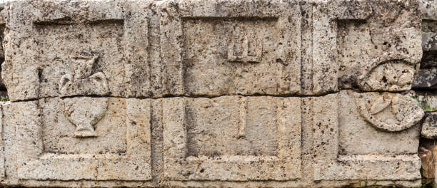 istock Greek symols on stone plate 958975510