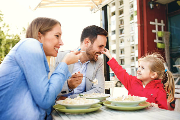 istock Family Enjoying Restaurant 958976086
