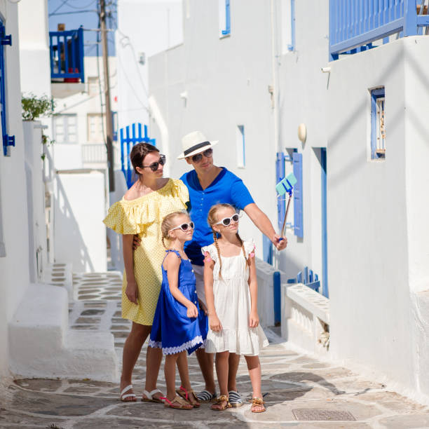 istock Family having fun outdoors on Mykonos streets 958978026
