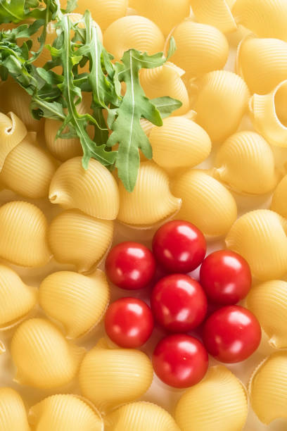 istock Food background Uncooked Macaroni Lumaconi 958984082