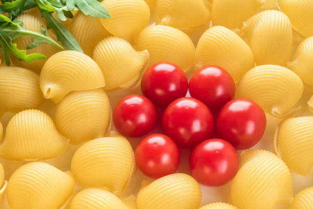 istock Food background Uncooked Macaroni Lumaconi 958984126