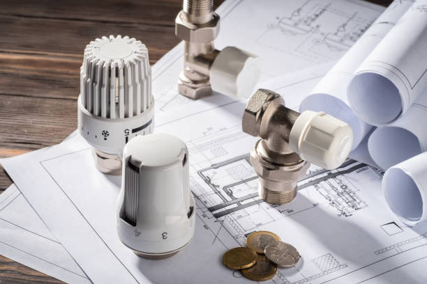 Concept of Energy saving Thermostatic Head Valve for Radiator Heater Coin Money notepad for entries Heating Project Boiler room house Heat Supply Building Concept of Energy saving and conservation to pay for public service. machine valve photos stock pictures, royalty-free photos & images