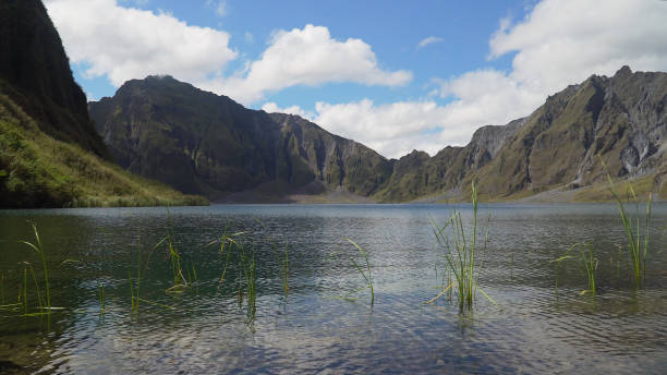 Crater Lake Pinatubo, Philippines, Luzon Crater lake of the volcano Pinatubo among the mountains, Philippines, Luzon. Beautiful landscape at Pinatubo mountain crater lake. Travel concept zambales province photos stock pictures, royalty-free photos & images