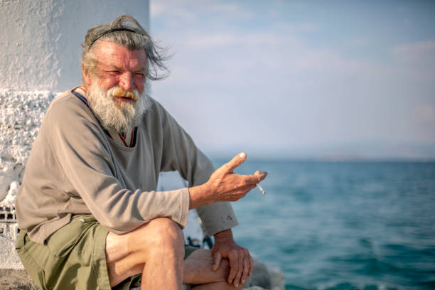 istock Old fisherman  by the sea 958989684