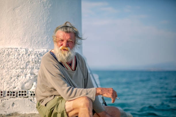 istock Old fisherman  by the sea 958989722