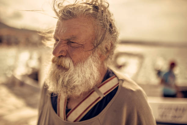 istock Old fisherman  by the sea 958989734