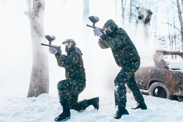 istock Two paintball players shooting at the enemy 958990022