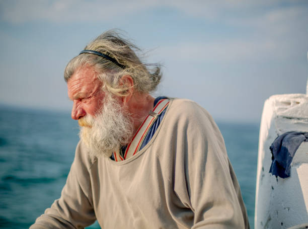 istock Old fisherman  by the sea 958992010
