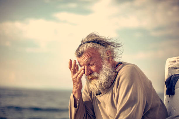 Old caucasian man fishing
