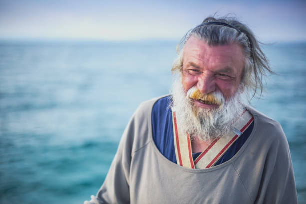 istock Old fisherman  by the sea 958992242