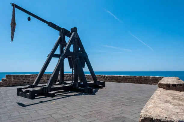 ancient catapult on the ramparts of Alghero in spring