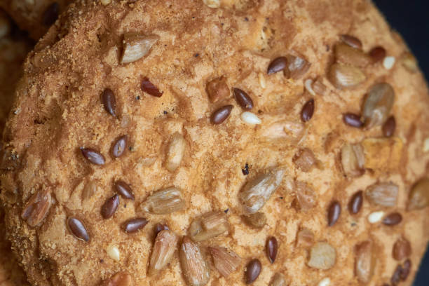 istock closeup oat large biscuits with sesame, flax and sunflower seeds. Macro 958996786
