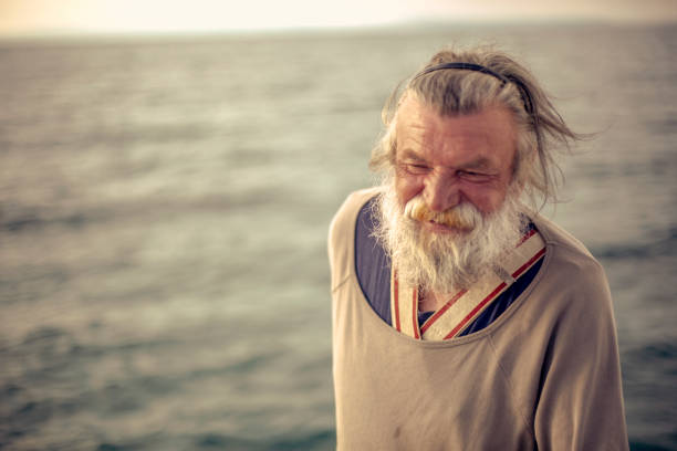 istock Old fisherman  by the sea 958996936