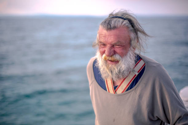 istock Old fisherman  by the sea 958996938