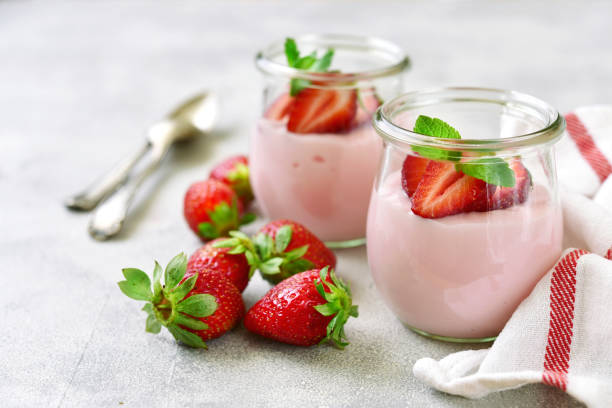 istock Natural strawberry yogurt with fresh berry 958999764