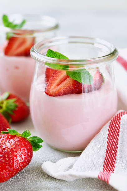 istock Natural strawberry yogurt with fresh berry 958999828