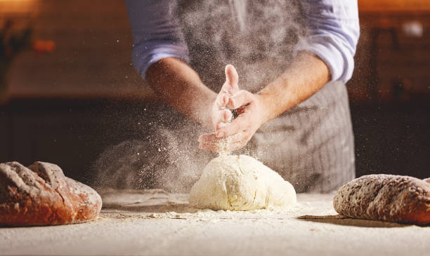 istock hands of baker's male knead dough 959011728