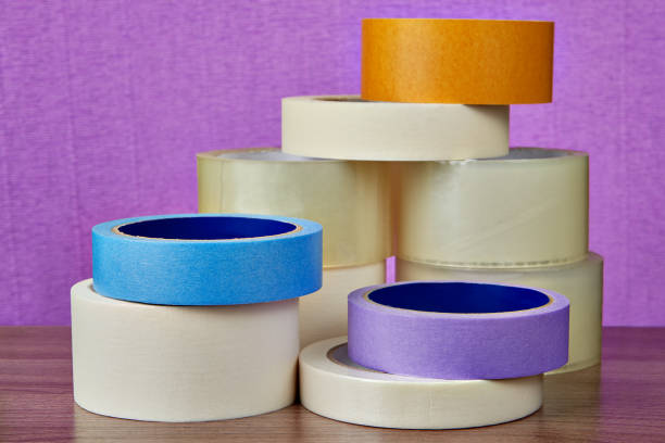 istock Rollers Scotch tape for various purposes in general heap. 959014880