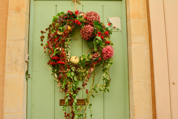 istock wreath on a wooden door 959016750