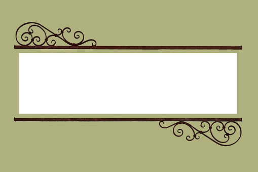 A decorative rustic old wrought iron frame information sign with a \n blank white copy space for text announcement centered on a warm green background.  The metal decoration is rusty retro style nostalgic curls with straight bars across.