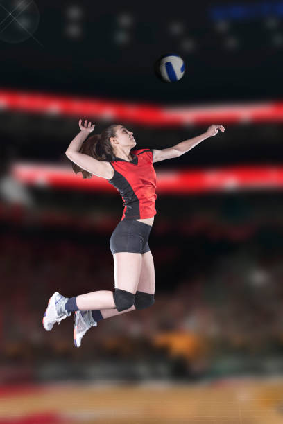 Female volleyball players jumping close-up on vollayball court. Female volleyball players jumping close-up on vollayball court young volleyball girl stock pictures, royalty-free photos & images