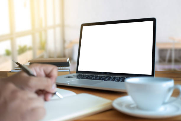 istock Laptop with blank screen on table. Workspace background new project on laptop computer with blank copy space screen for your advertising text message 959020712