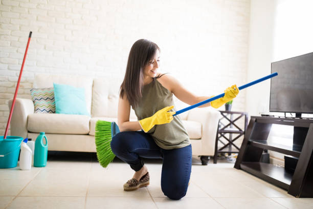istock Funny housewife having fun with a broom 959020802