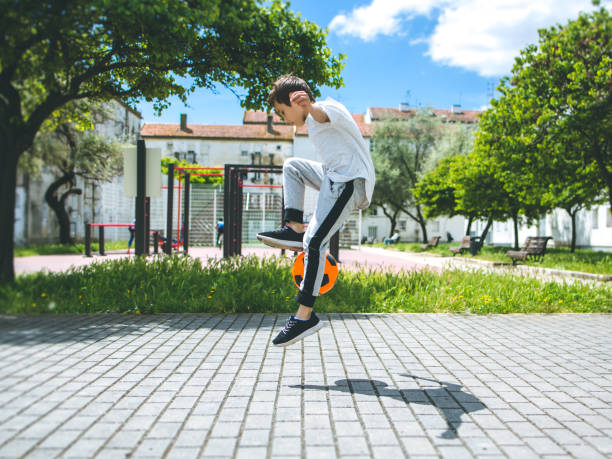 istock Boy play with football ball 959023140