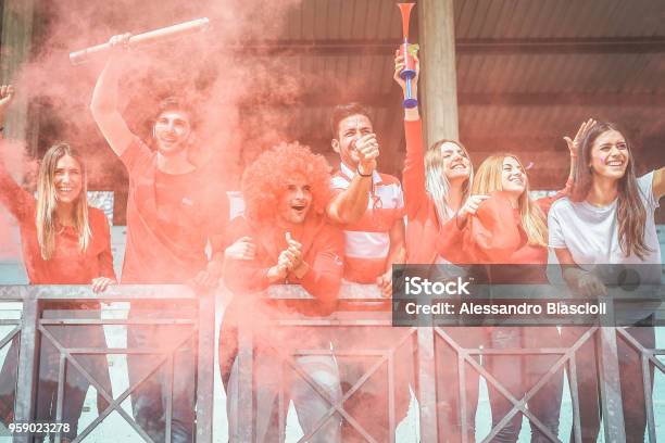 Football Supporter Fans Watching International Soccer Match At Stadium Young Group Of Excited Friends Having Fun Exulting At Soccer World Game Youth Sport And Celebration Score Concept Stock Photo - Download Image Now