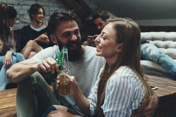 istock Flirting guy looking at the girl and making toast 959023820