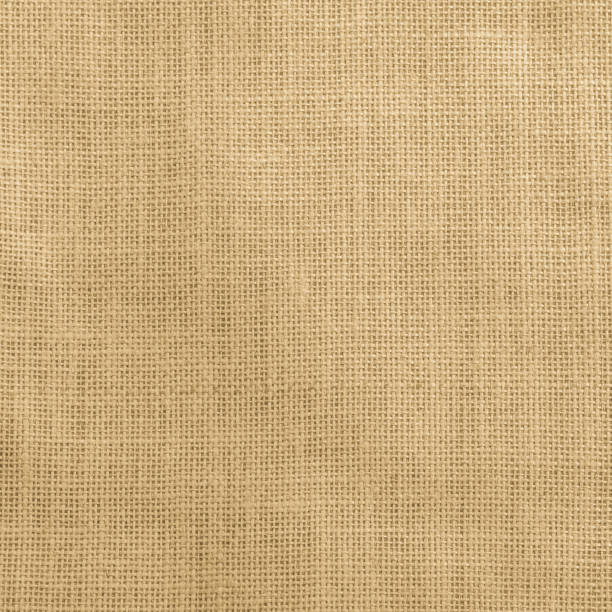 istock Jute fabric sackcloth burlap texture background yellow cream brown color 959024232