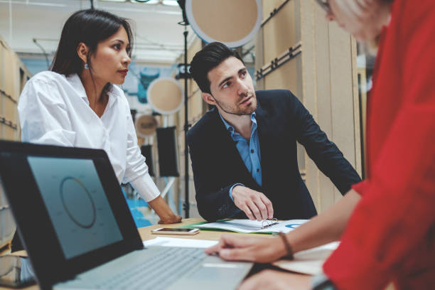 istock Group of serious creative professionals in meeting 959027796