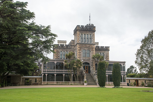 Port Chalmers, Dunedin, New Zealand-December 12,2016: Faade of the mock Larnach Castle on a cloudy day in Dunedin, New Zealand