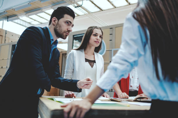 istock Group of serious creative professionals in meeting 959027938