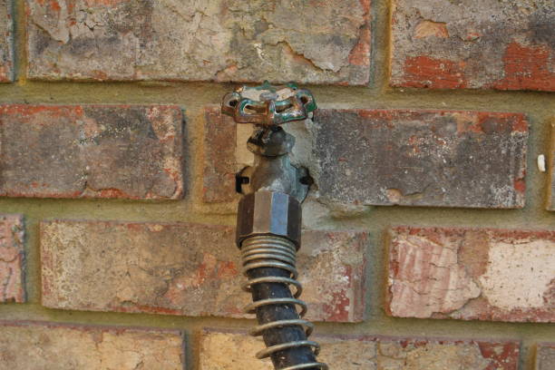istock outdoor faucet and hose 959028896