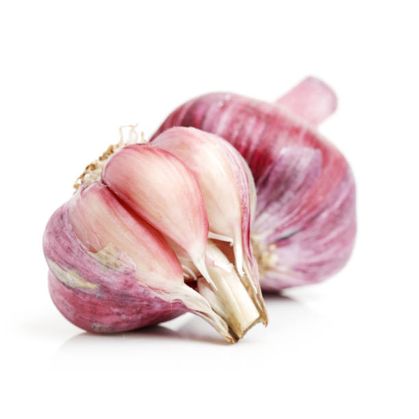 istock Garlic closeup isolated on white background 959031584