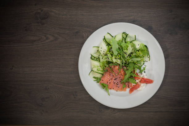 istock Meat of trout on a plate with vegetables and grapefruit 959031670